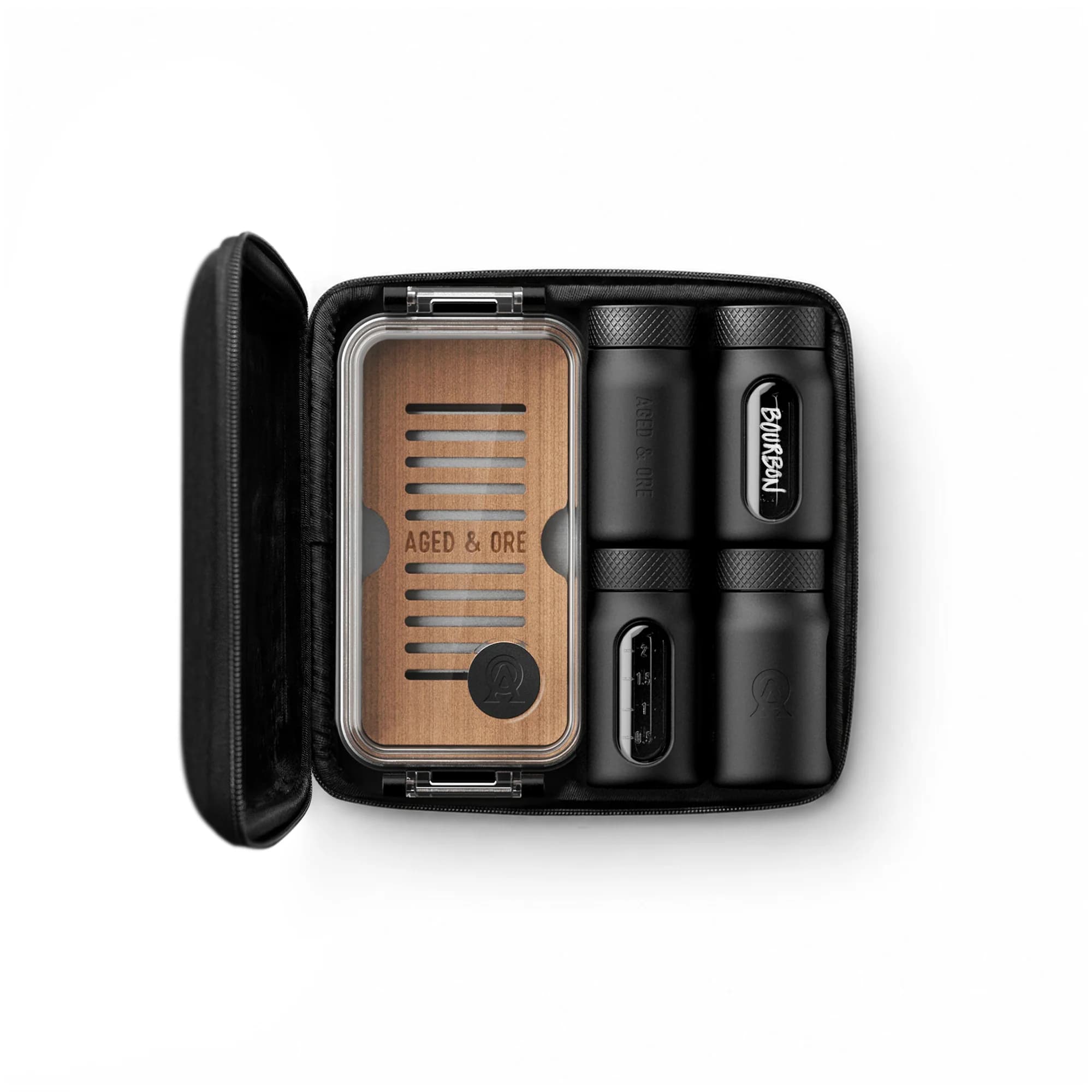 Aged & Ore Travel Humidor 3oz Bottle Set with cigars and flight bottles in a travel case