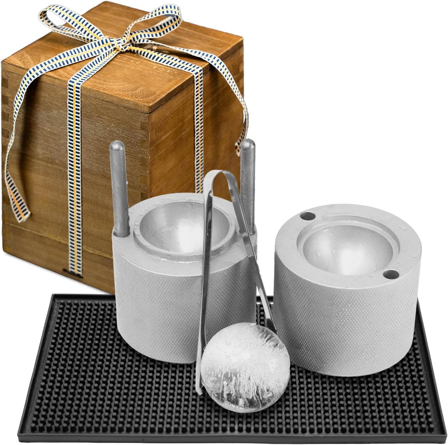 Aluminum ice ball press with a wooden gift box, tongs, bar mat, and a finished clear ice sphere
