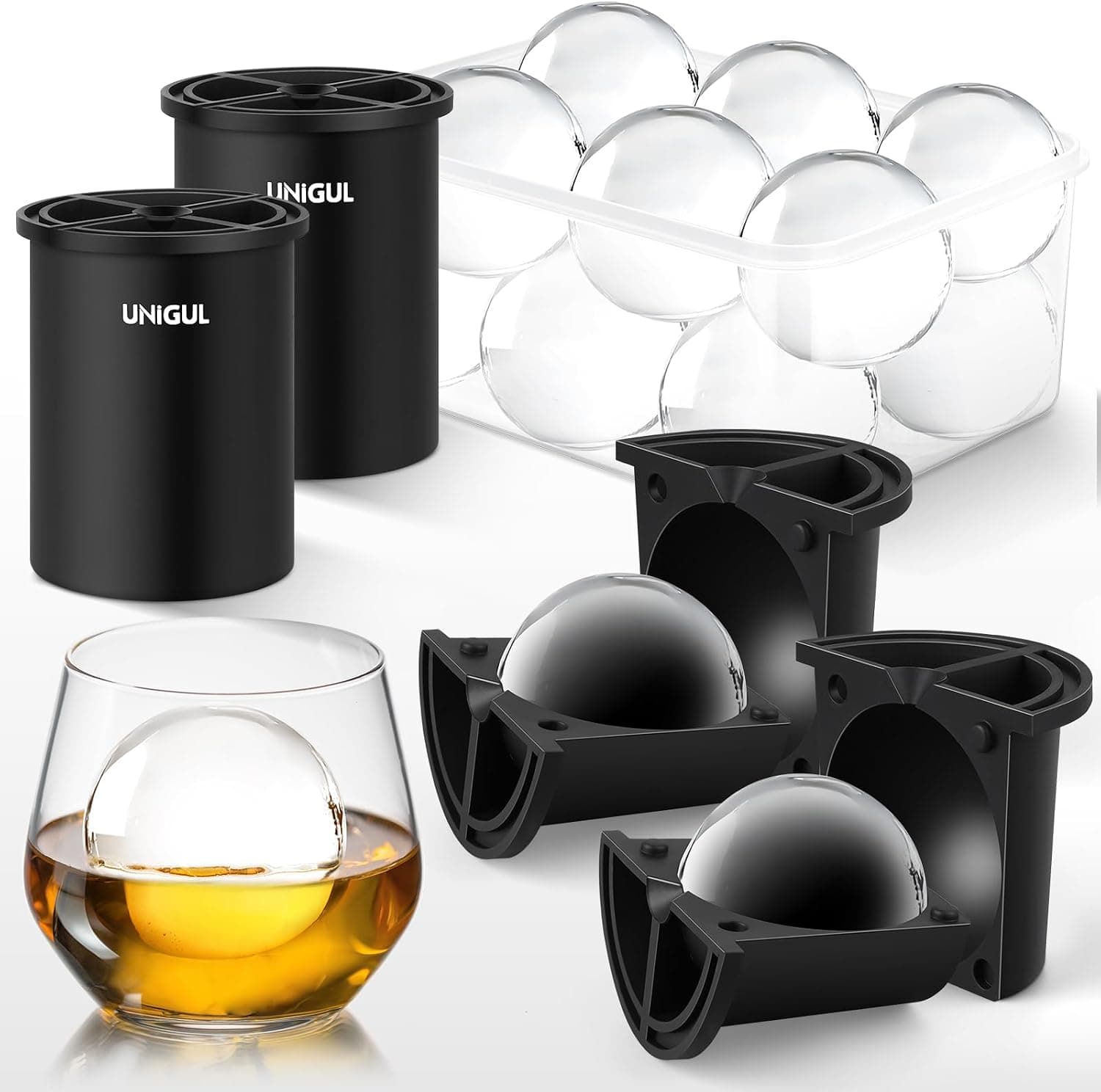 Unigul stainless vacuum-insulated ice ball molds in black with sphere trays, tongs, and a clear ice sphere in a whiskey glass