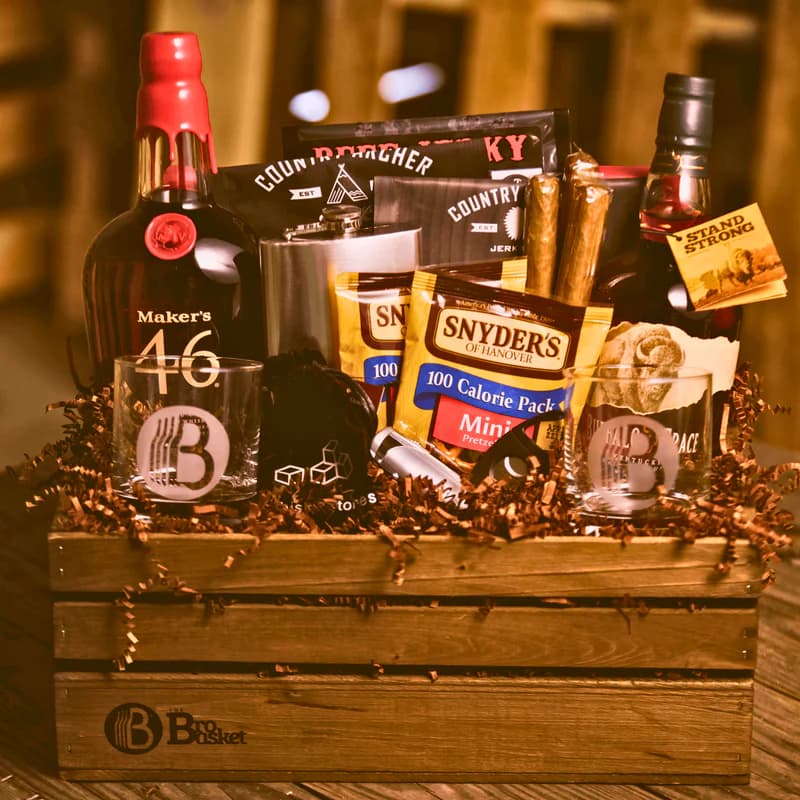 The Pride of Kentucky bourbon gift basket with full-size bourbon bottles, a flask, etched glasses, jerky, and cigars in a wooden crate