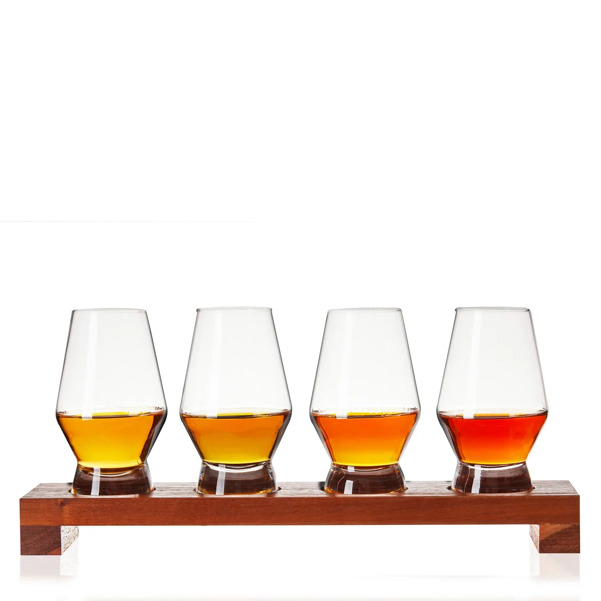 Viski crystal spirit flight set with four footed tasting glasses of whiskey on a wooden serving board