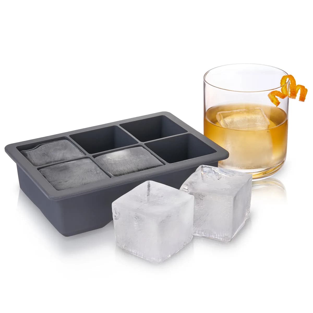 Viski Glacier silicone ice cube tray making six 2-inch cubes, with a whiskey on the rocks