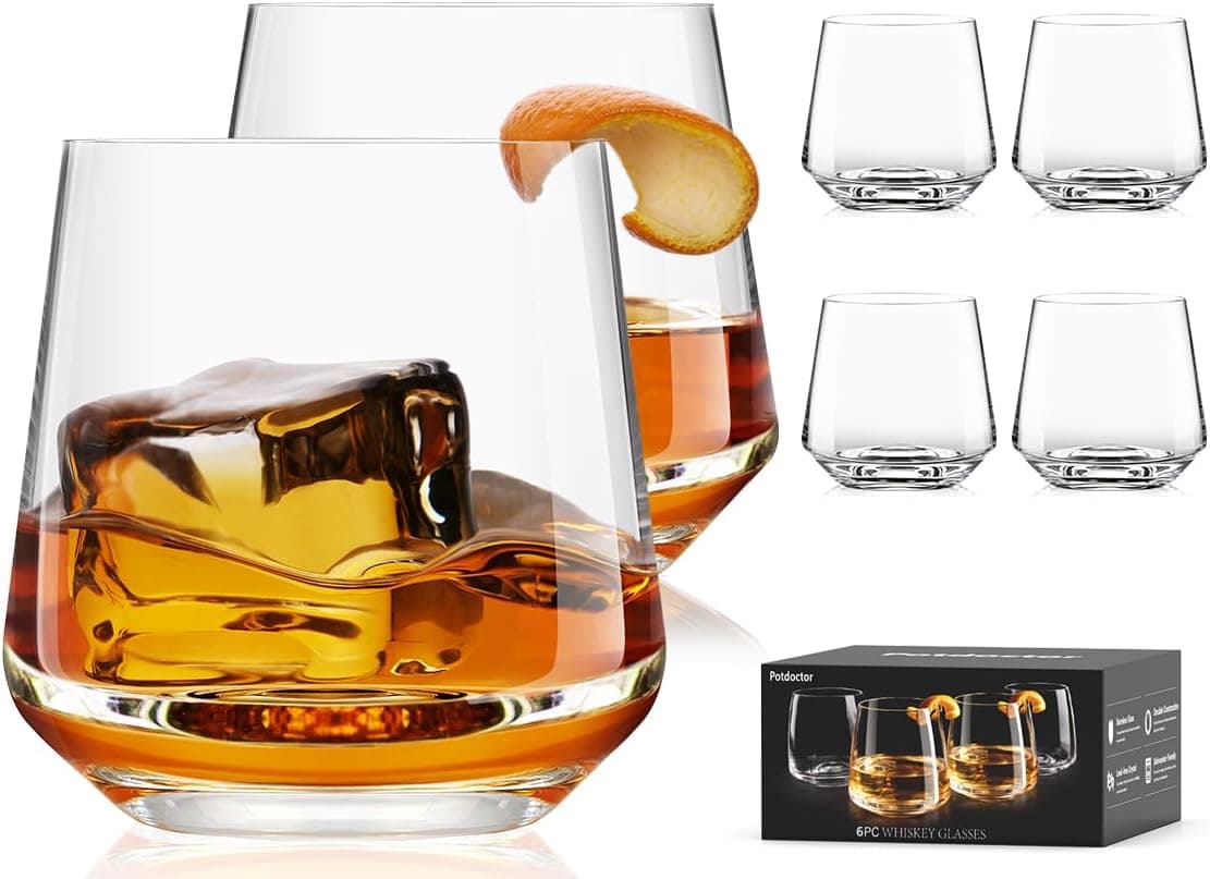 Set of six modern whiskey rocks glasses with contemporary design on a dark wooden surface